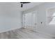The bedroom includes light gray walls, modern floors, double doors, and a fan at 11173 Concord Valley Dr, Las Vegas, NV 89135