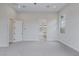 Spacious bedroom with plush carpet, access to bathroom, and lots of natural light at 11173 Concord Valley Dr, Las Vegas, NV 89135