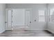 The light and airy bedroom features light gray walls, a window, and double doors to the next room at 11173 Concord Valley Dr, Las Vegas, NV 89135