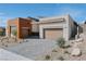 Home exterior with landscaping, driveway and attached garage at 11173 Concord Valley Dr, Las Vegas, NV 89135
