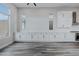 Spacious kitchen with white cabinets, long countertops, stainless steel appliances, and plenty of natural light at 11173 Concord Valley Dr, Las Vegas, NV 89135
