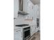 Modern kitchen with a stainless steel range hood, quartz countertops and stainless steel appliances at 11173 Concord Valley Dr, Las Vegas, NV 89135
