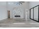 Spacious living room with a modern fireplace, high ceilings and large windows at 11173 Concord Valley Dr, Las Vegas, NV 89135