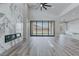 Bright living room boasts a fireplace, fan, and sliding doors to enhance the space at 11173 Concord Valley Dr, Las Vegas, NV 89135