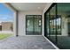 Large covered patio featuring seamless indoor/outdoor living with large sliding glass doors at 11173 Concord Valley Dr, Las Vegas, NV 89135