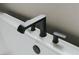 Close-up of modern matte black faucet on a white bathtub at 11173 Concord Valley Dr, Las Vegas, NV 89135