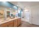 Modern bathroom with double sinks, granite countertop, a large mirror, and a glass shower at 1201 Dre Harbor Pl # Lot 80, North Las Vegas, NV 89084