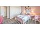 Charming bedroom featuring a metal frame bed and decorative tennis racket wall art at 1201 Dre Harbor Pl # Lot 80, North Las Vegas, NV 89084