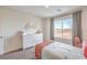 Cozy bedroom with a large window offering natural light and a neutral color palette at 1201 Dre Harbor Pl # Lot 80, North Las Vegas, NV 89084