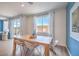 Charming dining area features a wood table, stylish chairs, and ample natural light at 1201 Dre Harbor Pl # Lot 80, North Las Vegas, NV 89084