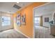 Bright hallway with artwork and neutral carpeting, leading to a naturally lit main bedroom suite at 1201 Dre Harbor Pl # Lot 80, North Las Vegas, NV 89084