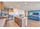 Open concept kitchen featuring stainless steel appliances, center island, and a view of the modern living area at 1201 Dre Harbor Pl # Lot 80, North Las Vegas, NV 89084