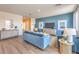 Spacious living room with modern decor, wood floors, and ample natural light at 1201 Dre Harbor Pl # Lot 80, North Las Vegas, NV 89084