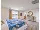 Sunlit main bedroom suite with neutral carpeting, a bright window, and stylish dresser for ample storage at 1201 Dre Harbor Pl # Lot 80, North Las Vegas, NV 89084