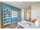 Stylish office with white desk, decorative shelving, and a view into the hallway and closet space at 1201 Dre Harbor Pl # Lot 80, North Las Vegas, NV 89084