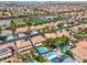 Stunning aerial view showcasing the pool, landscaping, and surrounding neighborhood at 1312 Fragrant Spruce Ave, Las Vegas, NV 89123