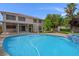 Exterior image showcasing a large in-ground pool and spa with a manicured backyard at 1312 Fragrant Spruce Ave, Las Vegas, NV 89123