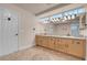 Bathroom featuring double sinks, tile flooring, a large mirror, and ample lighting at 1312 Fragrant Spruce Ave, Las Vegas, NV 89123