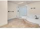 Bathroom featuring tiled floors, a shower, and a soaking tub at 1312 Fragrant Spruce Ave, Las Vegas, NV 89123
