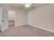 Carpeted bedroom with adjoining bathroom access and walk-in closet at 1312 Fragrant Spruce Ave, Las Vegas, NV 89123