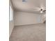 Open carpeted bedroom area featuring a ceiling fan and natural light at 1312 Fragrant Spruce Ave, Las Vegas, NV 89123