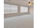 Bright bedroom featuring neutral carpeting and natural light, offering a comfortable and inviting atmosphere at 1312 Fragrant Spruce Ave, Las Vegas, NV 89123