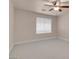 A serene bedroom featuring neutral walls, carpet, ceiling fan, and a bright window at 1312 Fragrant Spruce Ave, Las Vegas, NV 89123