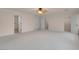 Spacious bedroom featuring neutral carpeting, with easy access to closets and bathrooms at 1312 Fragrant Spruce Ave, Las Vegas, NV 89123