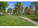 Green community park with mature trees, walking paths, and manicured lawns at 1312 Fragrant Spruce Ave, Las Vegas, NV 89123