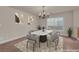 Traditional dining room featuring a marble table set under an elegant chandelier at 1312 Fragrant Spruce Ave, Las Vegas, NV 89123