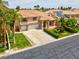 Aerial view of a two-story home with a tile roof, two-car garage, and mature landscaping at 1312 Fragrant Spruce Ave, Las Vegas, NV 89123