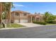 Beautiful two-story home with three-car garage, desert landscaping, and terracotta roofing at 1312 Fragrant Spruce Ave, Las Vegas, NV 89123