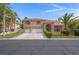 Charming two-story home with three-car garage, desert landscaping, and a terracotta roof at 1312 Fragrant Spruce Ave, Las Vegas, NV 89123