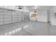 Spacious three car garage with epoxy floors and built in cabinets for optimal storage at 1312 Fragrant Spruce Ave, Las Vegas, NV 89123