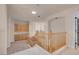 Loft space featuring wooden railing, and built in cabinets at 1312 Fragrant Spruce Ave, Las Vegas, NV 89123
