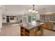 Open concept kitchen with an island, granite countertops and easy access to the backyard at 1312 Fragrant Spruce Ave, Las Vegas, NV 89123