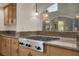 Close up of granite countertops and stainless steel gas cooktop in the kitchen at 1312 Fragrant Spruce Ave, Las Vegas, NV 89123