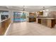 Kitchen area with access to the pool featuring wood cabinets and granite countertops at 1312 Fragrant Spruce Ave, Las Vegas, NV 89123