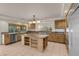 Kitchen featuring granite countertops, stainless steel appliances, and custom wood cabinetry at 1312 Fragrant Spruce Ave, Las Vegas, NV 89123