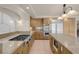 Spacious kitchen featuring granite countertops, stainless steel appliances, and custom wood cabinetry at 1312 Fragrant Spruce Ave, Las Vegas, NV 89123