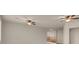 Open living room featuring two ceiling fans, and open access to other rooms at 1312 Fragrant Spruce Ave, Las Vegas, NV 89123