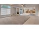 The living room showcases an open floor plan leading to the kitchen and an inviting fireplace at 1312 Fragrant Spruce Ave, Las Vegas, NV 89123