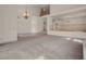 Open living room area with chandelier and railing overlooking the lower level at 1312 Fragrant Spruce Ave, Las Vegas, NV 89123