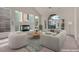 Bright and airy living room with modern furniture, fireplace and large windows at 1312 Fragrant Spruce Ave, Las Vegas, NV 89123
