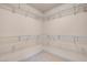 Spacious walk-in closet featuring adjustable shelving to maximize storage and organization at 1312 Fragrant Spruce Ave, Las Vegas, NV 89123