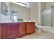 Bathroom with double sink vanity, framed mirror, and a glass-enclosed shower at 1370 Crystal Hill Ln # 3, Henderson, NV 89012