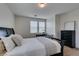 Bedroom showcasing a comfortable bed, desk, and dresser with plenty of natural light at 1370 Crystal Hill Ln # 3, Henderson, NV 89012