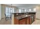 Modern kitchen with granite countertops, stainless steel sink, and stylish dining area at 1370 Crystal Hill Ln # 3, Henderson, NV 89012