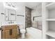 Modern bathroom featuring a wood vanity and gray tiled shower at 1415 Helen Ave, North Las Vegas, NV 89030