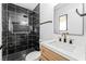 Beautiful bathroom featuring black marble style tiling in shower and matte gold fixtures at 1415 Helen Ave, North Las Vegas, NV 89030